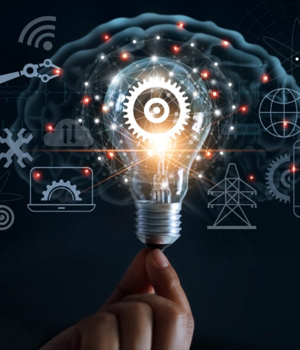 Hand holding light bulb and cog inside and innovation icon network connection on brain background, innovative technology in science and industrial concept